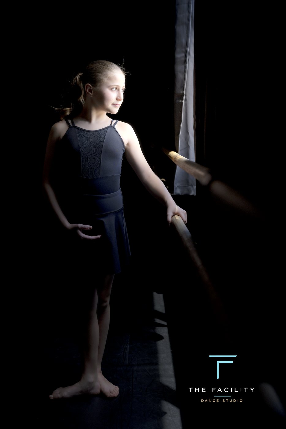 Dancer in first position at the barre