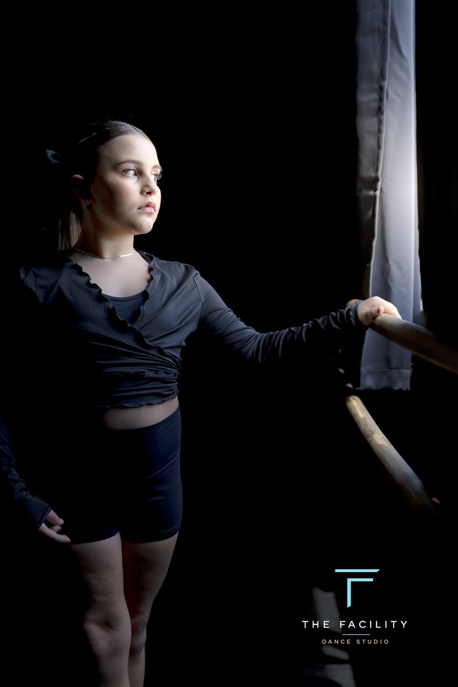Dancer reaching along the barre