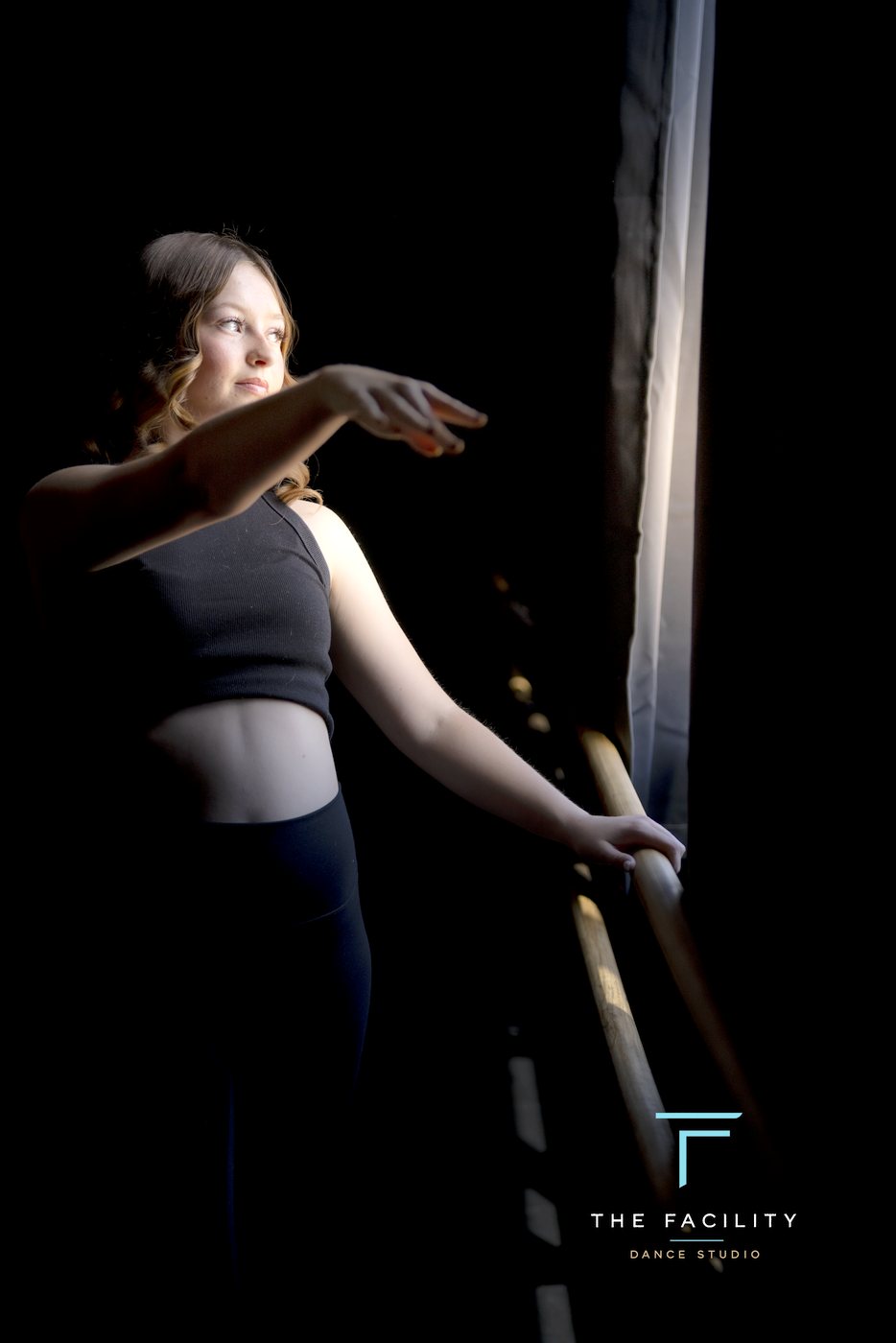 Dancer stretching over the barre