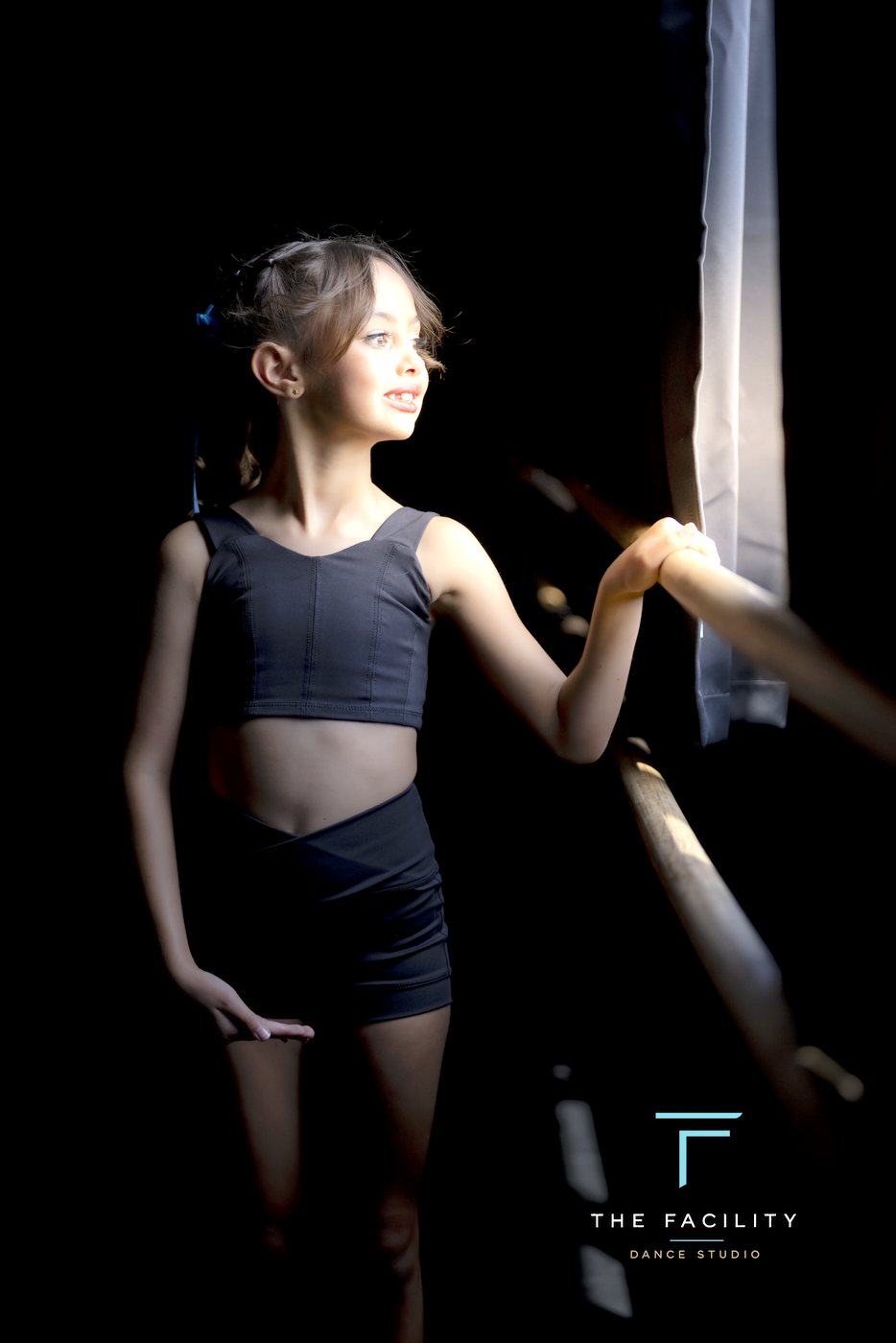 Young dancer smiling in window light