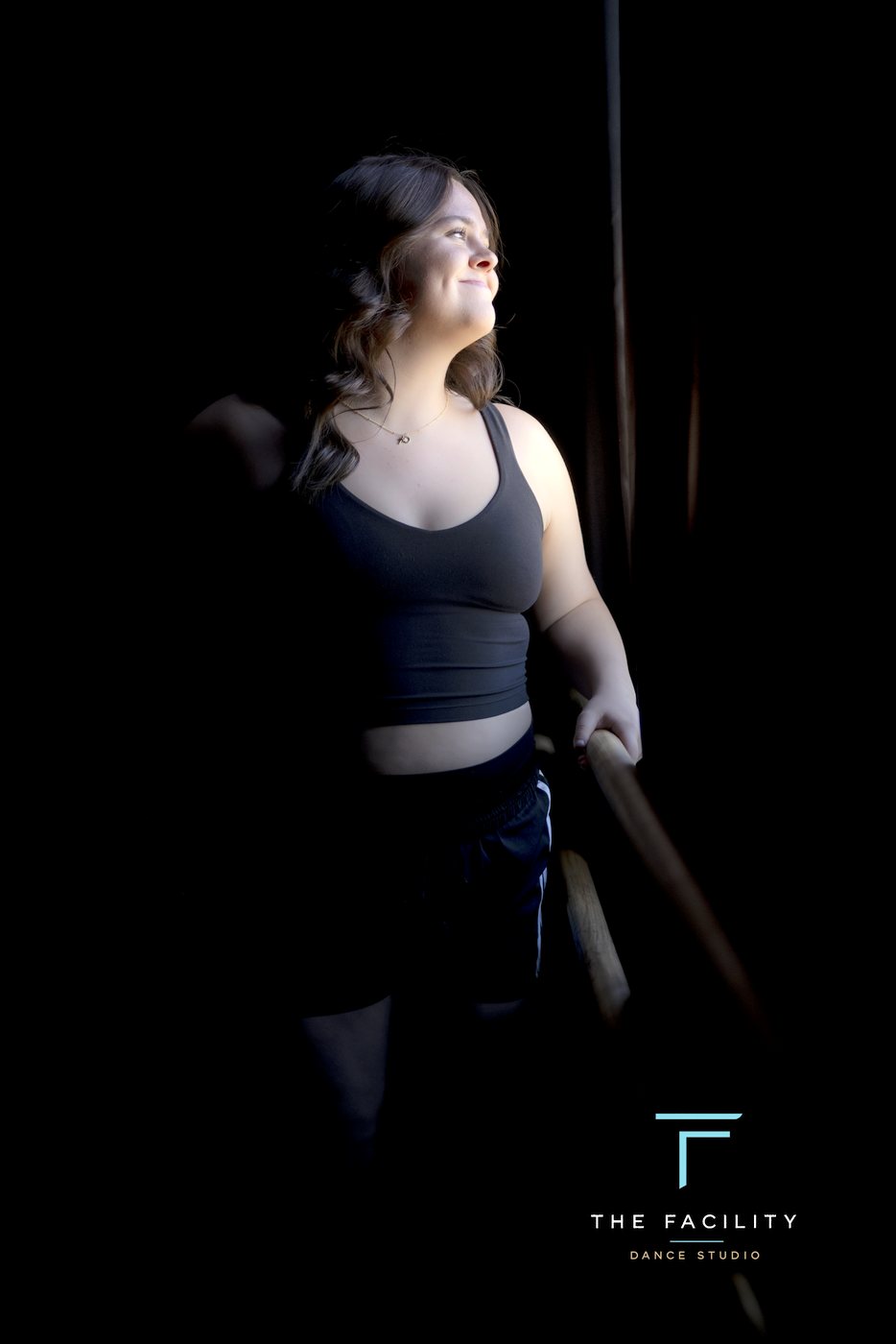 Dancer laughing in the window light