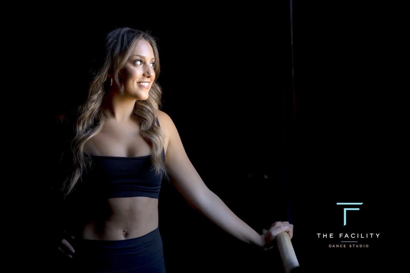 Smiling dancer holding the barre