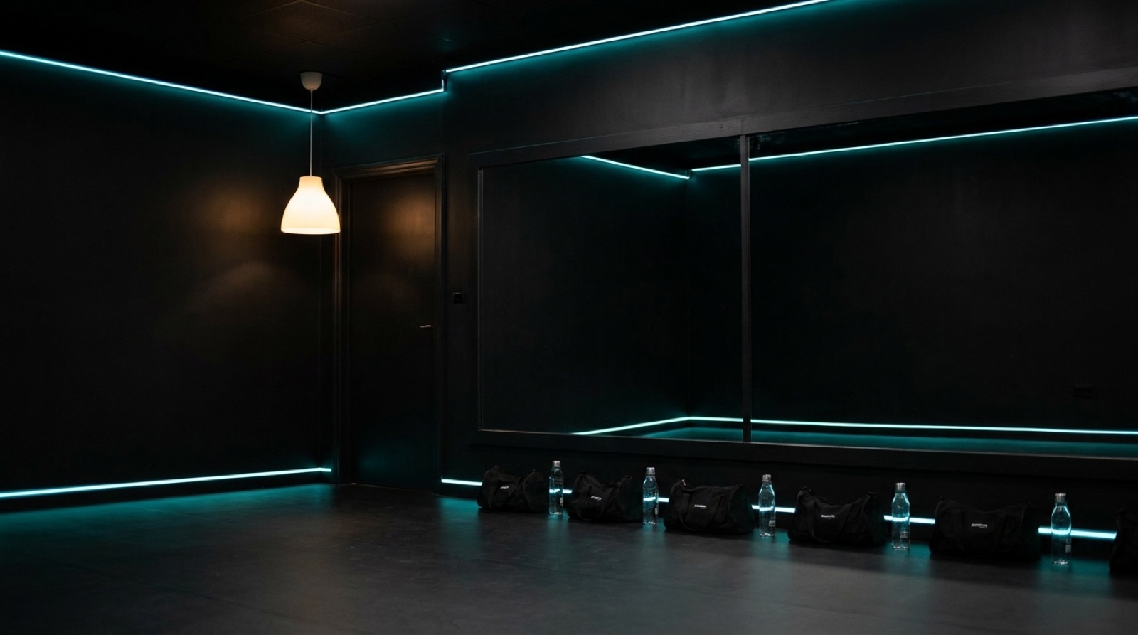 Studio 2, an all-black studio lit with teal LED light