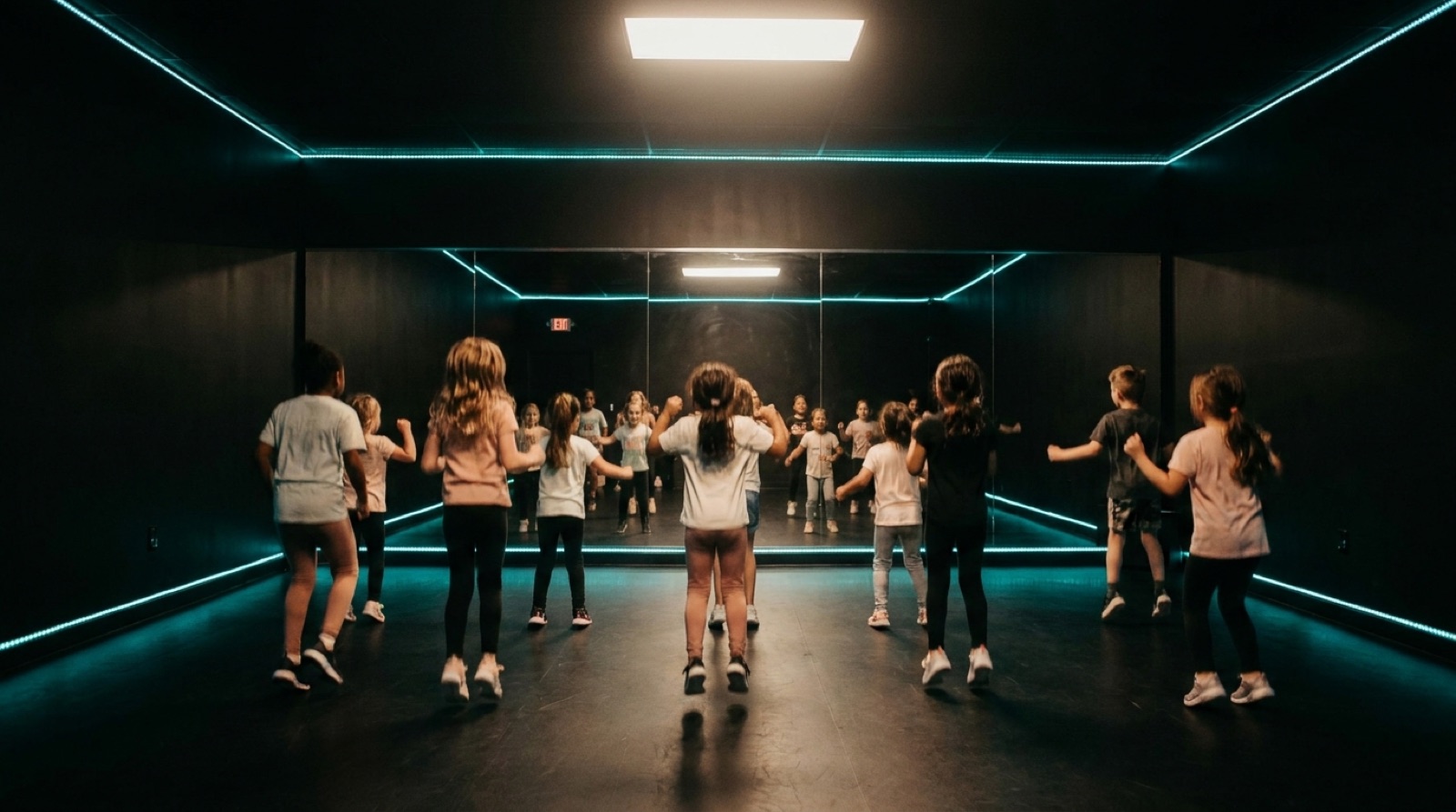 Studio 4, an all-black studio lit with teal LED light